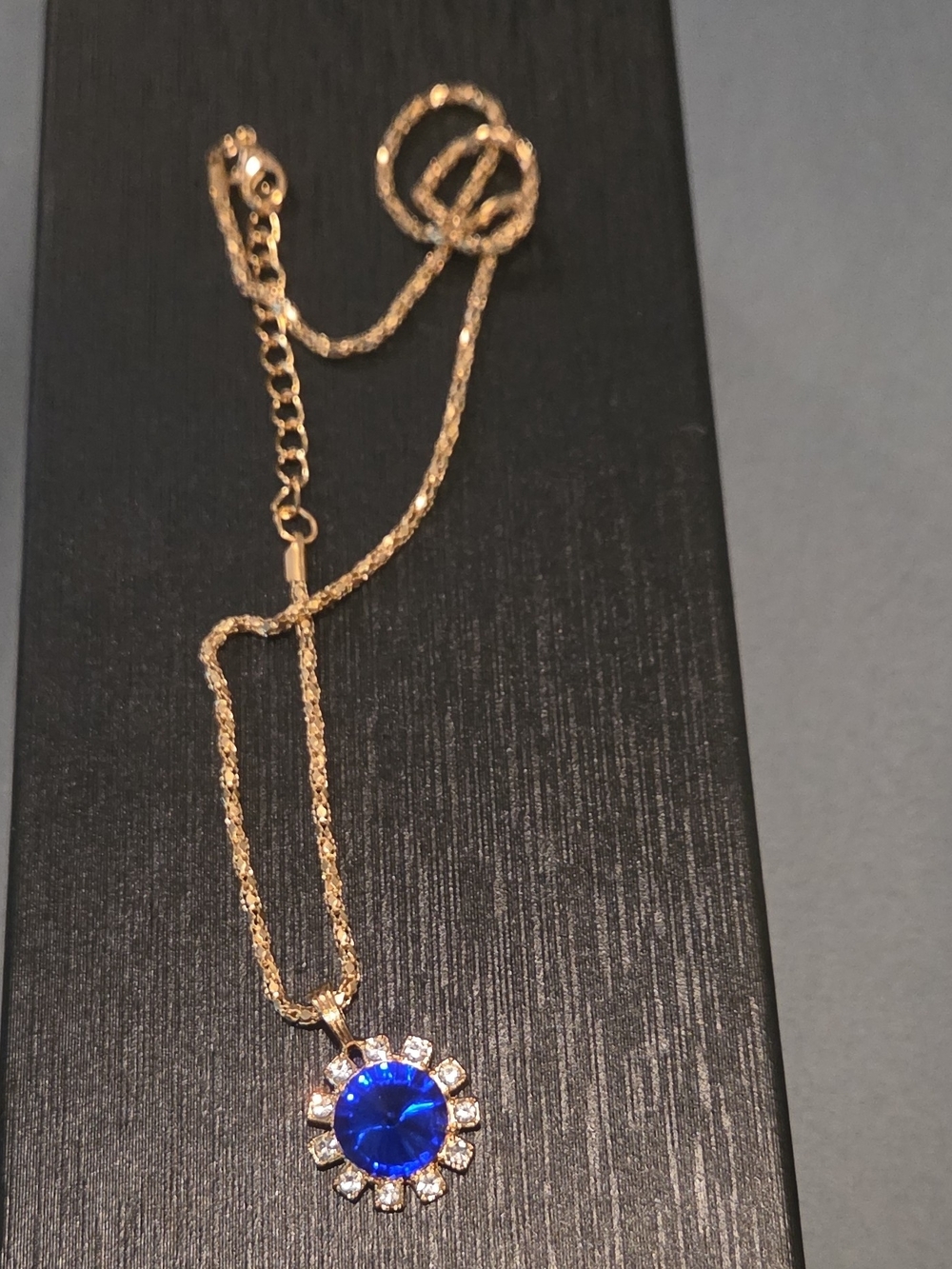 Gold Chain Necklace with Blue Crystal Sunburst Pendant